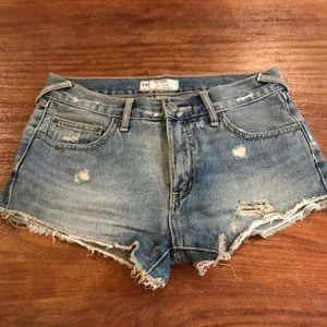 Distressed light wash denim shorts